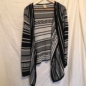 Black and white patterned cardigan.